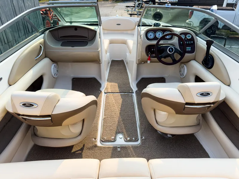 Slide: The Image of Interior of a 2007 Chaparral 190 SSi boat with beige seating and dashboard. - 9