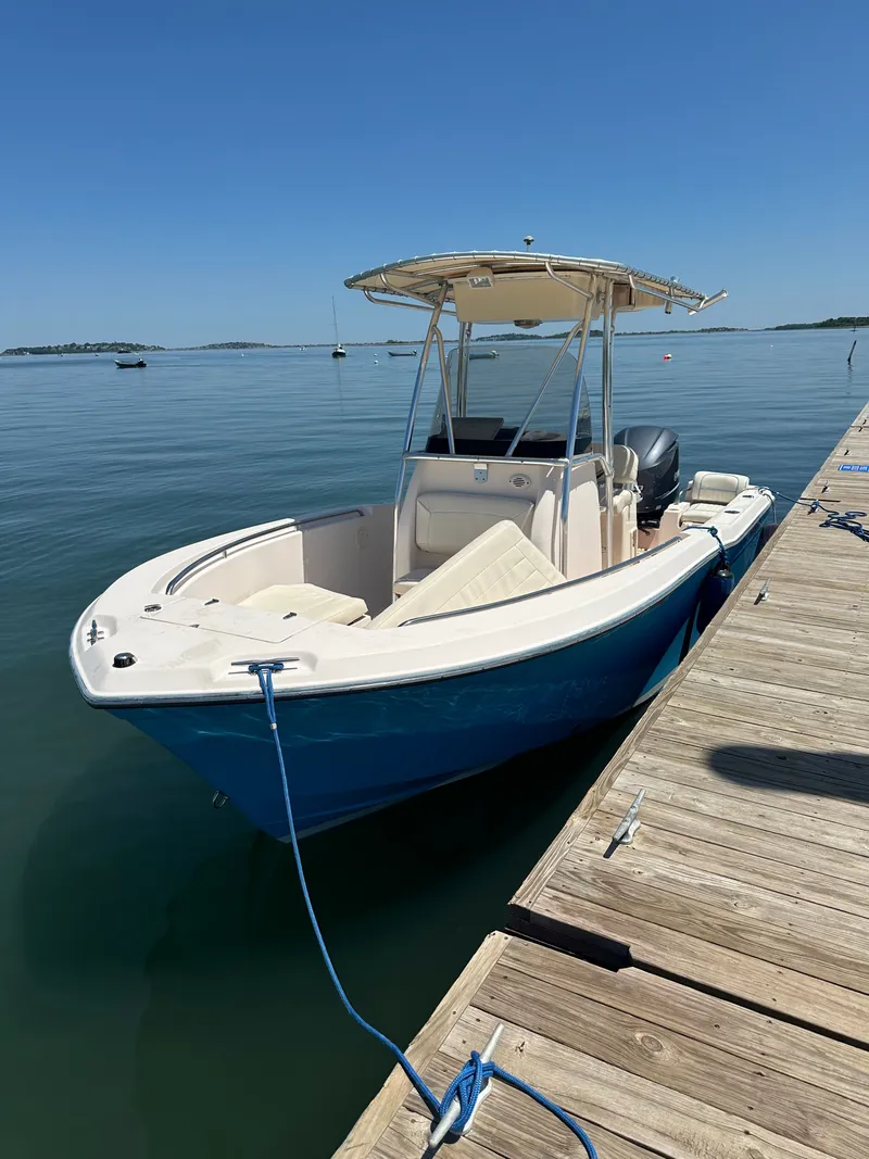Slide: The Image of 2011 Grady-White Fisherman 209 boat docked under clear sky. - 2