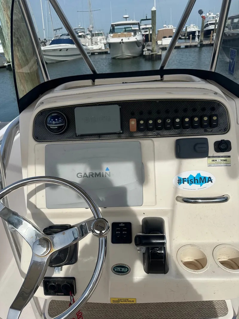 Slide: The Image of 2011 Grady-White Fisherman 209 boat console at marina. - 6