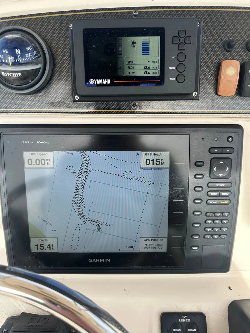 Slide: The Image of Grady-White Fisherman 209 boat dashboard with Garmin GPS and Yamaha display. - 7