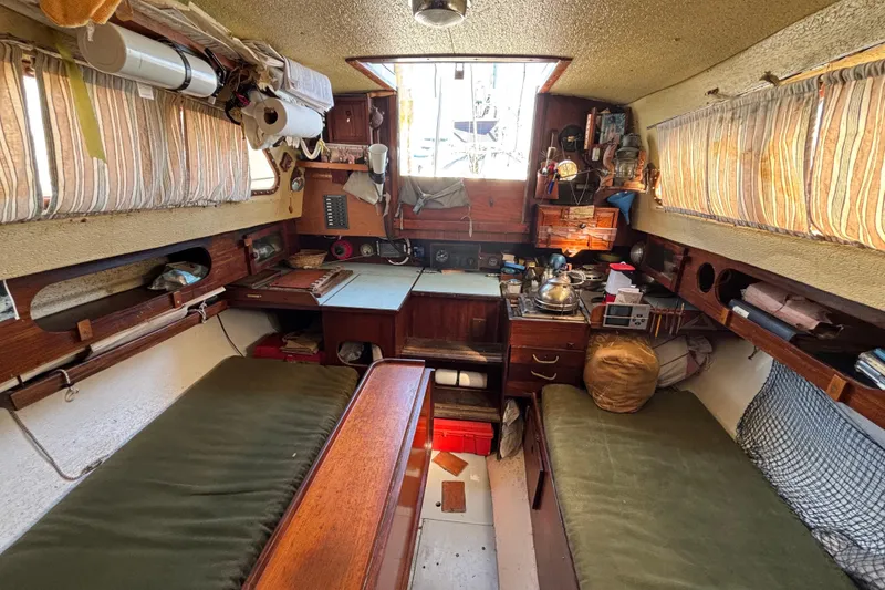 Slide: The Image of Interior of a 1970 King's Cruiser 28 sailboat with cozy cabin setup. - 18