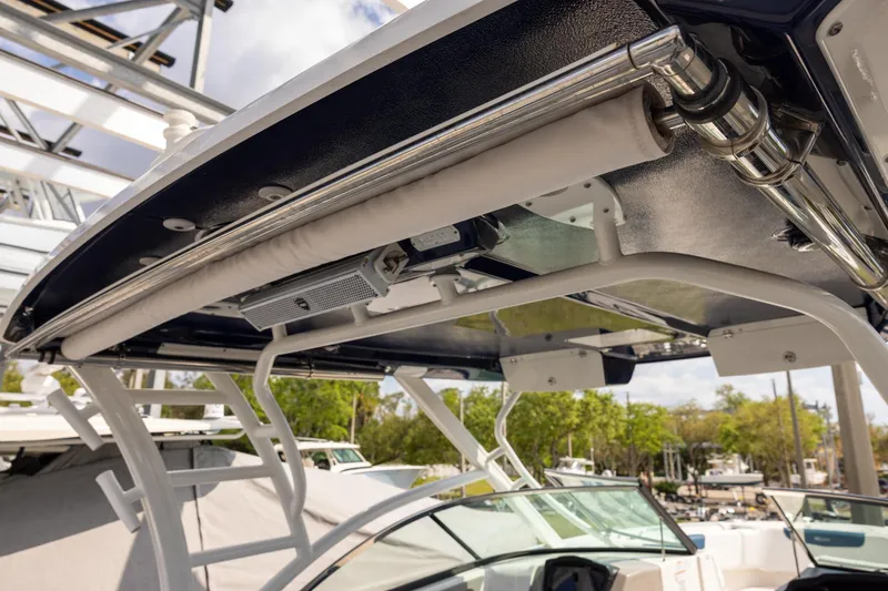 Slide: The Image of 2019 Robalo R317 Dual Console boat with sleek overhead design and stainless steel fittings. - 18