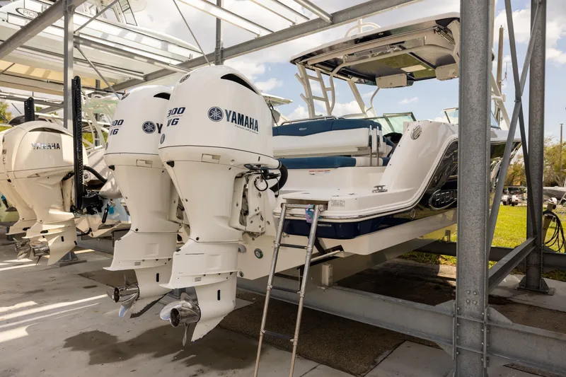 Slide: The Image of 2019 Robalo R317 Dual Console boat with Yamaha engines in storage. - 3
