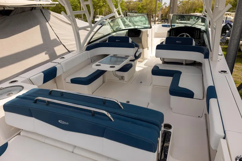Slide: The Image of 2019 Robalo R317 Dual Console boat interior with blue and white seating and modern design. - 4