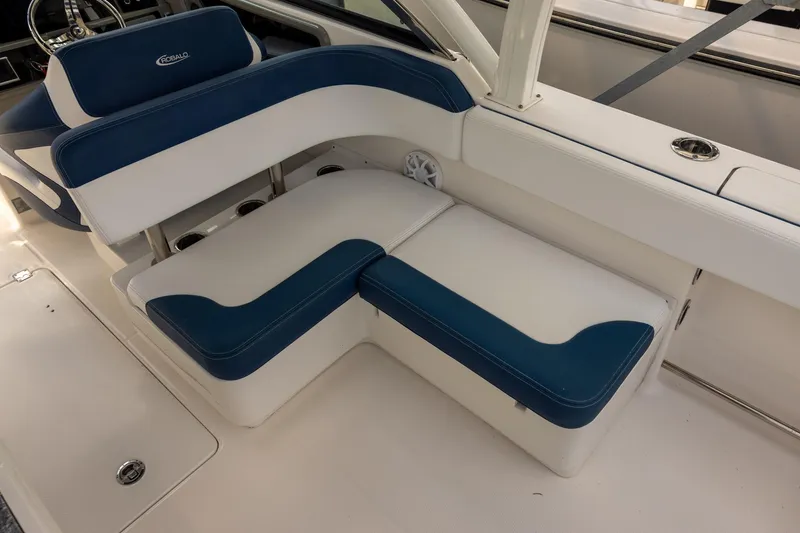 Slide: The Image of 2019 Robalo R317 Dual Console boat interior with blue and white seating. - 7