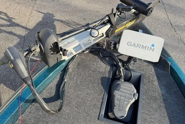 Slide: The Image of 1994 Javelin 389T boat with Garmin navigation and trolling motor setup. - 13