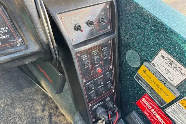 Slide: The Image of Control panel of a 1994 Javelin 389T boat with switches and capacity labels. - 19