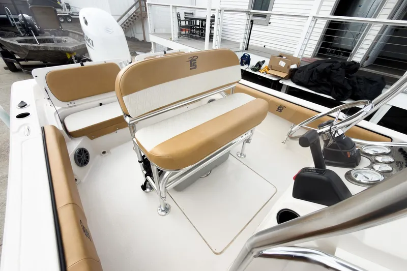 Slide: The Image of 2025 Carolina Skiff 21 Ultra Elite boat interior with tan and white seating. - 15