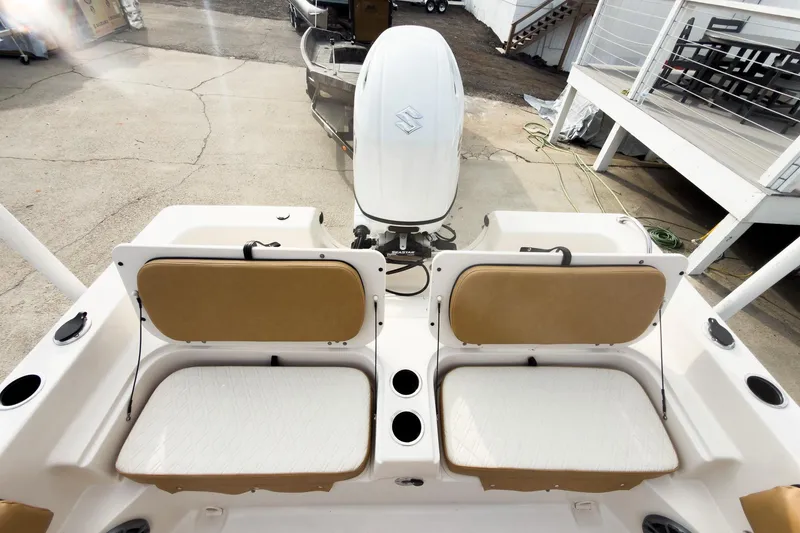 Slide: The Image of 2025 Carolina Skiff 21 Ultra Elite boat with dual seats and outboard motor. - 19