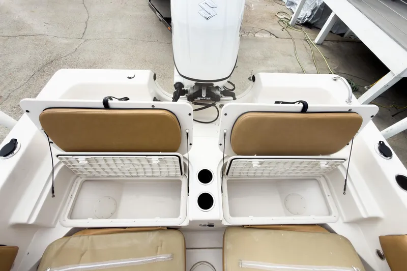 Slide: The Image of 2025 Carolina Skiff 21 Ultra Elite boat interior with storage compartments and seating. - 20