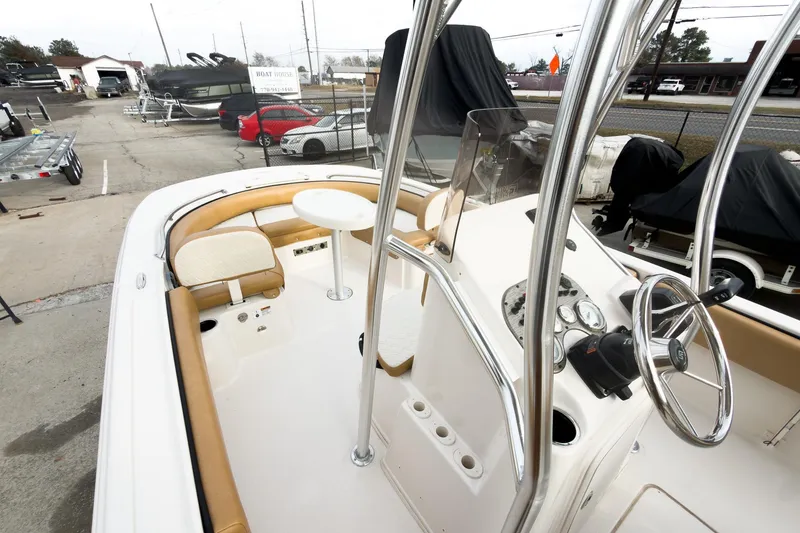 Slide: The Image of 2025 Carolina Skiff 21 Ultra Elite boat interior with steering console and seating. - 21