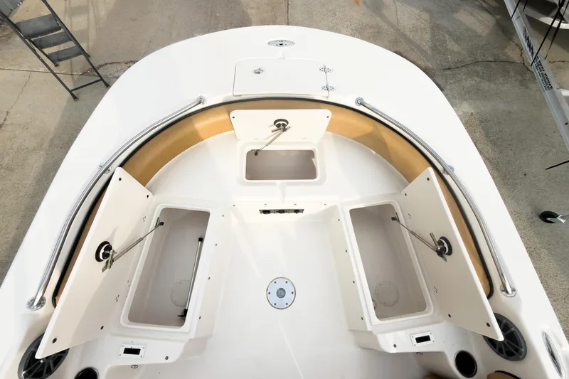 Slide: The Image of 2025 Carolina Skiff 21 Ultra Elite boat interior with open storage compartments. - 26
