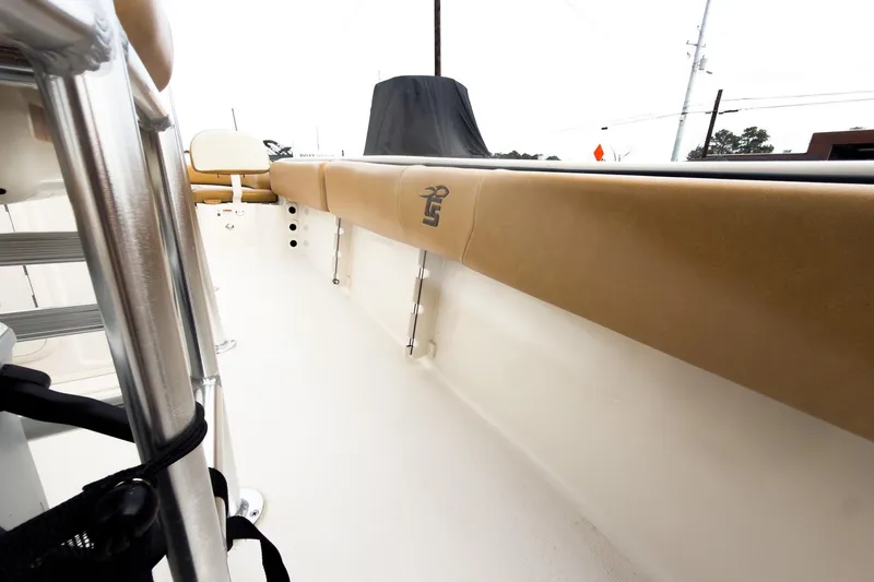 Slide: The Image of 2025 Carolina Skiff 21 Ultra Elite interior with tan seating and stainless steel details. - 28