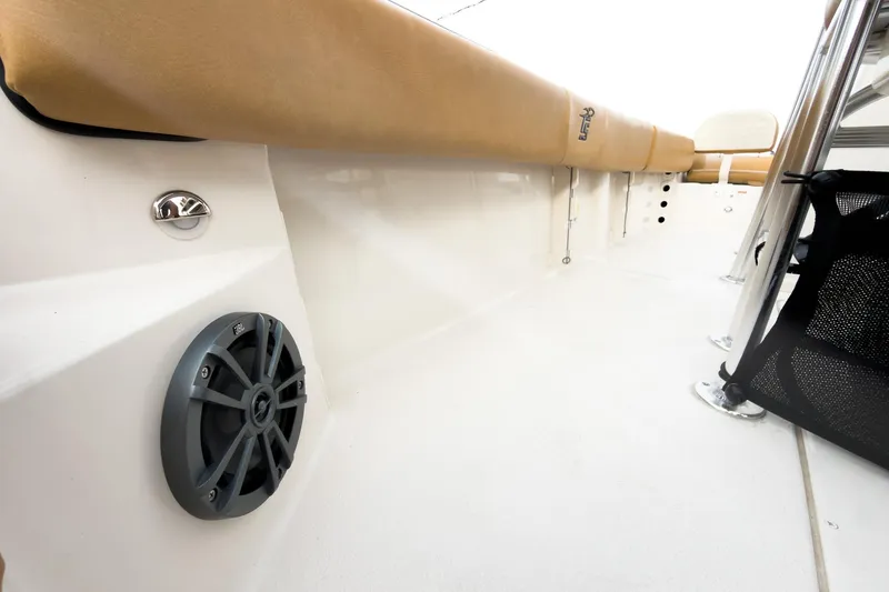 Slide: The Image of 2025 Carolina Skiff 21 Ultra Elite interior with tan seating and JBL speaker. - 29