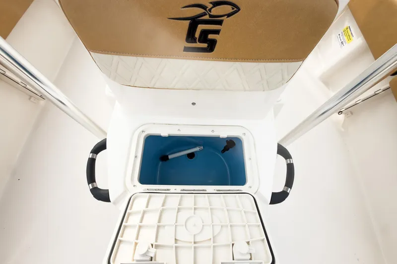 Slide: The Image of 2025 Carolina Skiff 21 Ultra Elite boat interior with storage compartment open. - 31