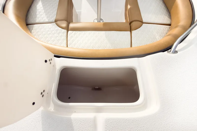 Slide: The Image of 2025 Carolina Skiff 21 Ultra Elite boat storage compartment with cushioned seating. - 34