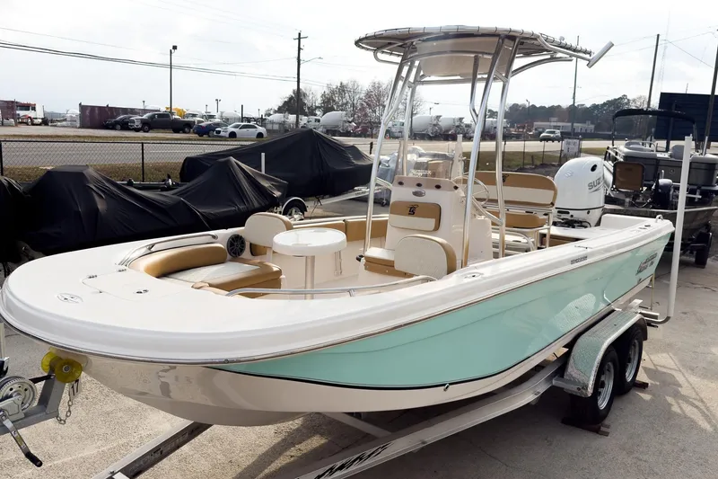 Slide: The Image of 2025 Carolina Skiff 21 Ultra Elite boat on trailer, featuring sleek design and modern amenities. - 4