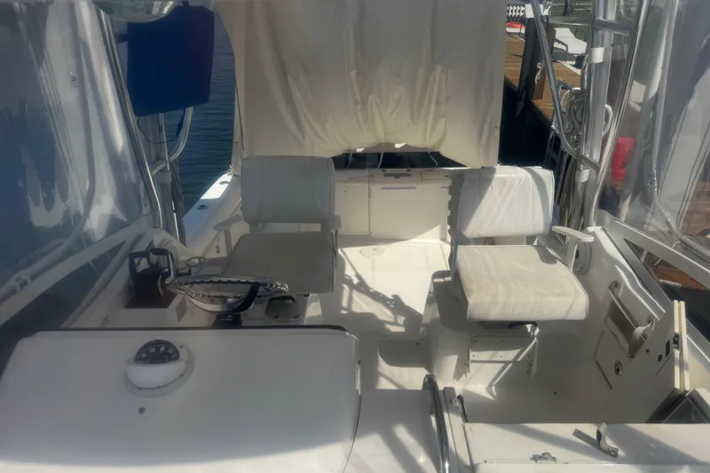 Slide: The Image of 2005 Century 3200 Walk-Around boat interior with seating and navigational equipment. - 10