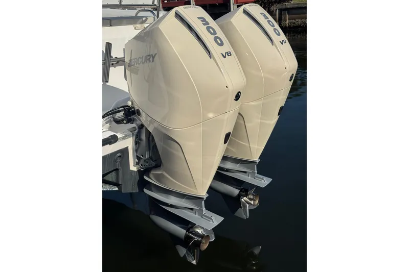 Slide: The Image of Twin Mercury 300 V8 outboard engines on a 2005 Century 3200 Walk-Around boat. - 100