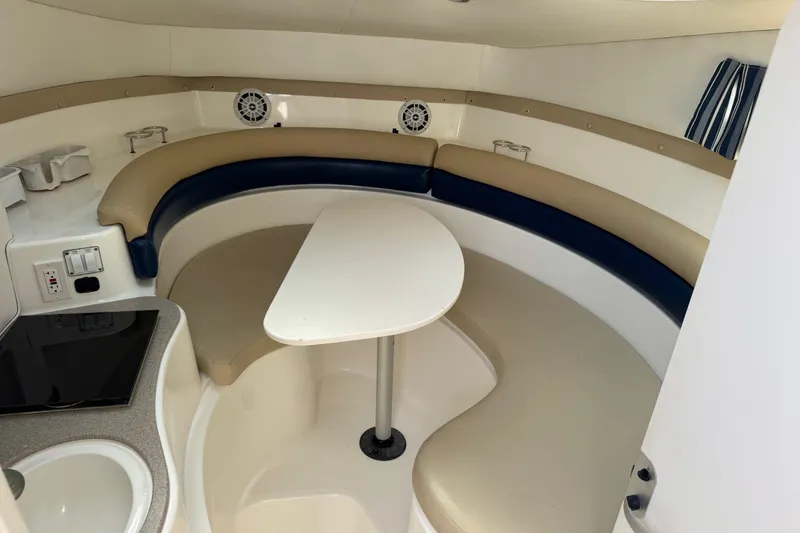 Slide: The Image of 2005 Century 3200 Walk-Around cabin interior with seating and table. - 13