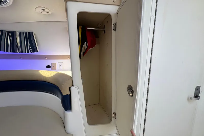 Slide: The Image of 2005 Century 3200 Walk-Around cabin interior with open storage compartment. - 19