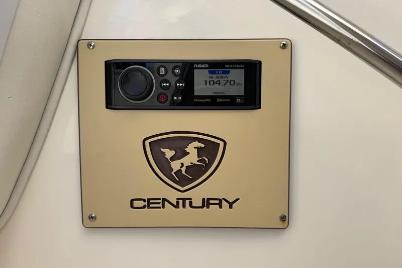 Slide: The Image of Century 3200 Walk-Around 2005 boat stereo system with logo and control panel. - 28