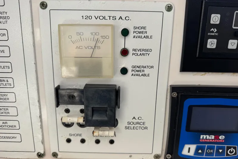 Slide: The Image of Control panel of a 2005 Century 3200 Walk-Around boat with AC voltage meter. - 31