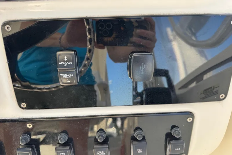 Slide: The Image of Control panel of a 2005 Century 3200 Walk-Around boat with windlass and USB switches. - 36