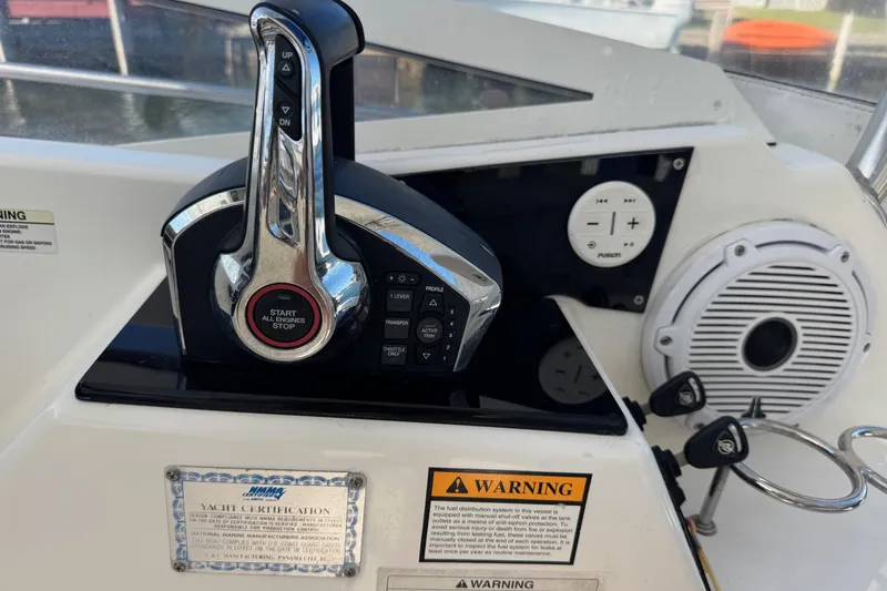Slide: The Image of Control panel of a 2005 Century 3200 Walk-Around boat with engine start-stop button. - 41