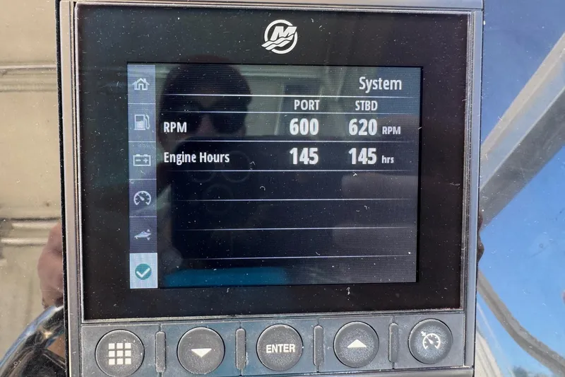 Slide: The Image of Display screen showing RPM and engine hours for Century 3200 Walk-Around boat, 2005 model. - 44
