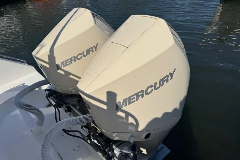 Slide: The Image of Twin Mercury outboard engines on a 2005 Century 3200 Walk-Around boat. - 46