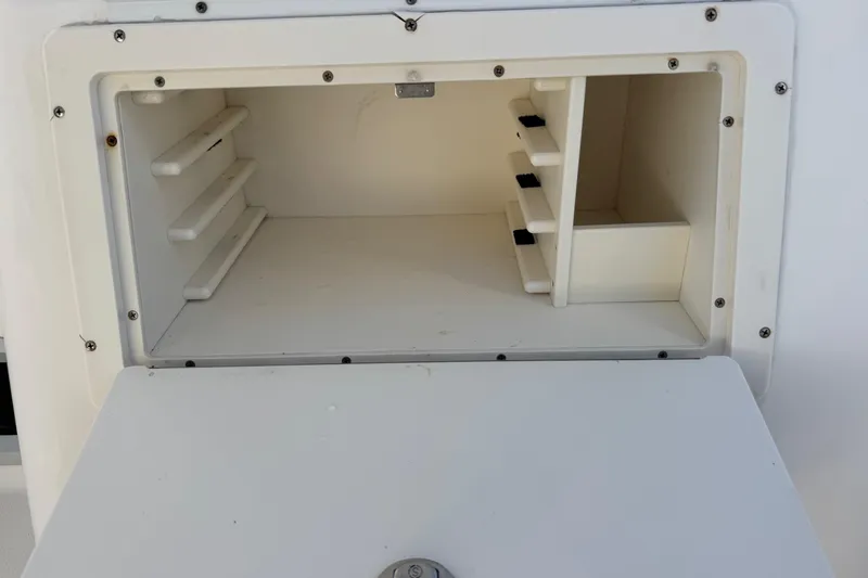Slide: The Image of Open storage compartment on a 2005 Century 3200 Walk-Around boat. - 66
