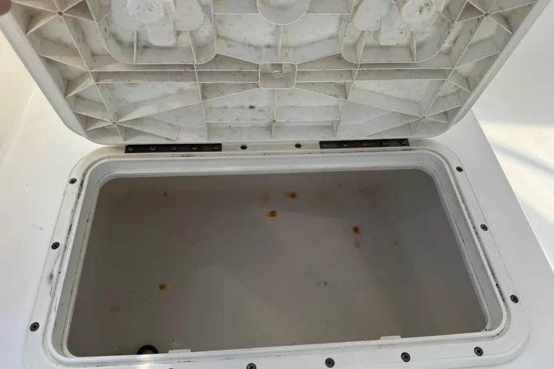 Slide: The Image of Open storage compartment on a 2005 Century 3200 Walk-Around boat. - 67