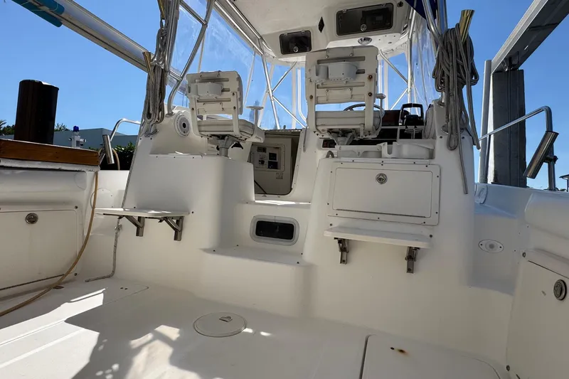 Slide: The Image of 2005 Century 3200 Walk-Around boat interior with seating and control panel. - 7