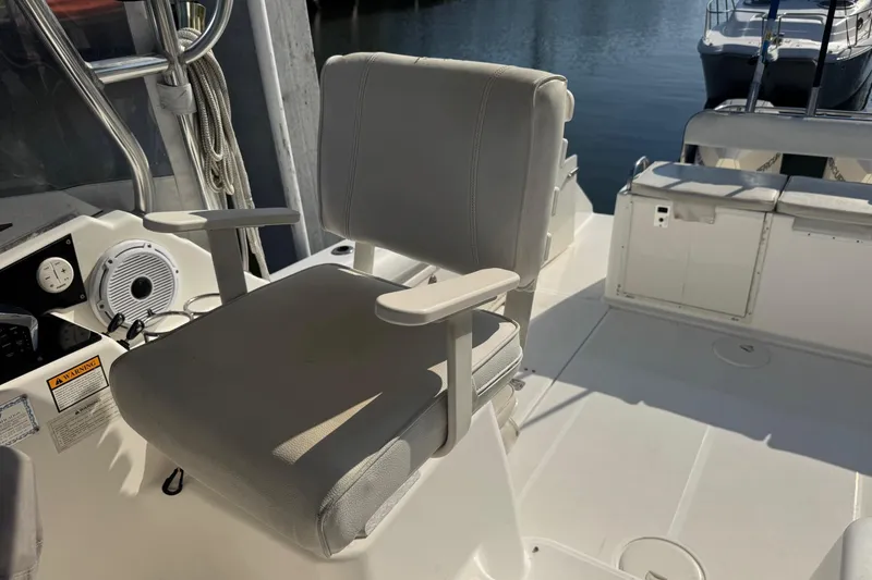 Slide: The Image of Captain's chair on 2005 Century 3200 Walk-Around boat, docked by the water. - 72