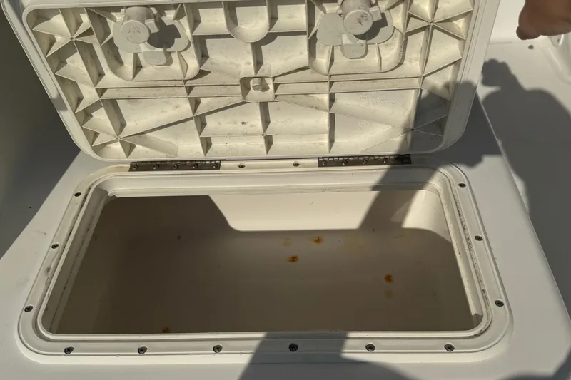 Slide: The Image of Open storage compartment on a 2005 Century 3200 Walk-Around boat. - 77