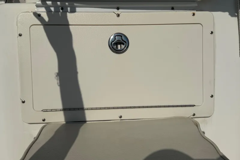 Slide: The Image of Hatch door on a 2005 Century 3200 Walk-Around boat, featuring a secure latch. - 79