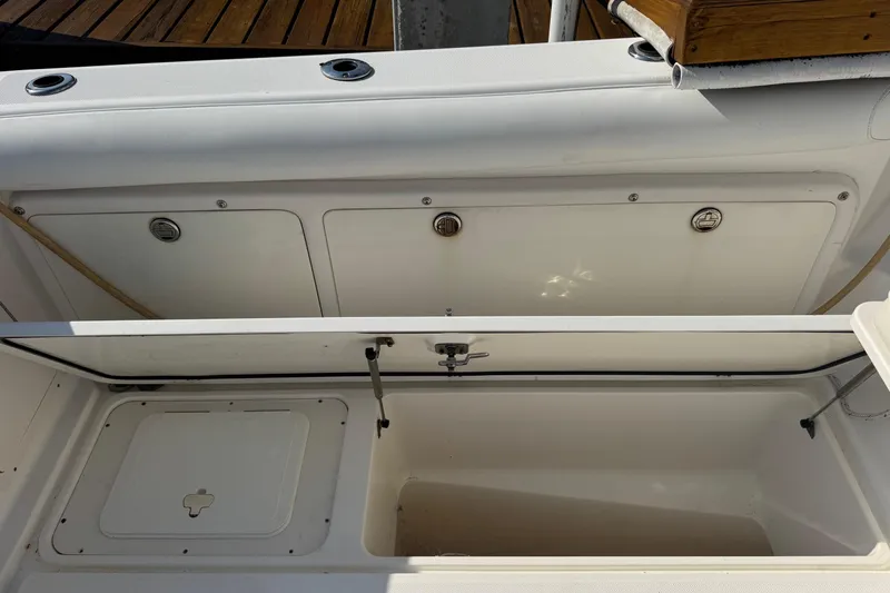 Slide: The Image of 2005 Century 3200 Walk-Around boat storage compartments, open and ready for use. - 86
