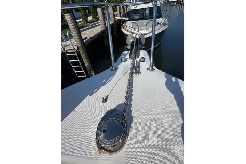 Slide: The Image of Bow view of 2005 Century 3200 Walk-Around boat with anchor chain and winch. - 89