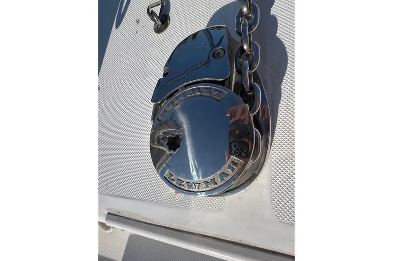 Slide: The Image of Chrome anchor windlass on 2005 Century 3200 Walk-Around boat deck. - 90