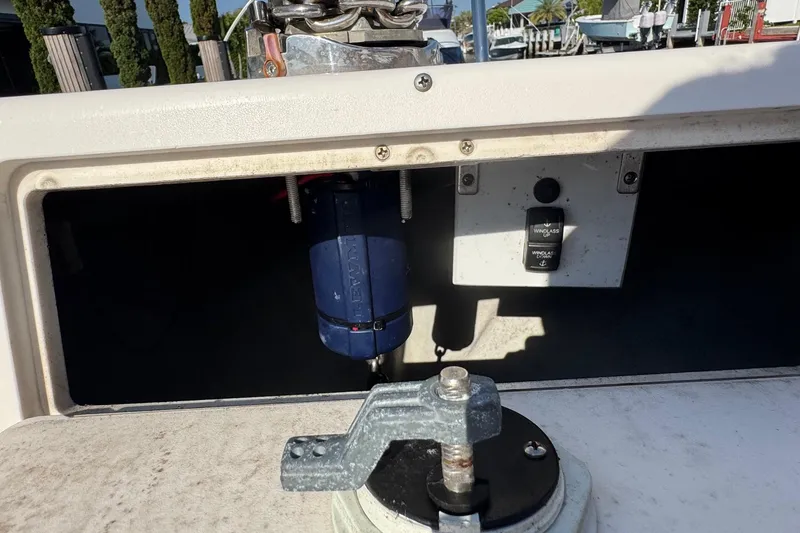 Slide: The Image of 2005 Century 3200 Walk-Around boat windlass system with control panel and anchor chain. - 91