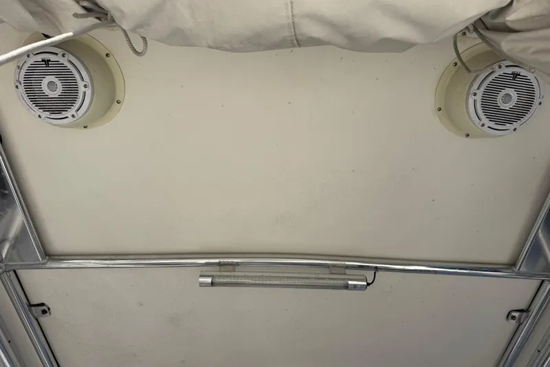 Slide: The Image of Ceiling view of 2005 Century 3200 Walk-Around boat with speakers and light fixture. - 94