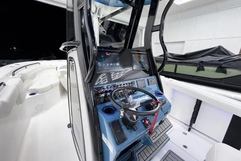 Slide: The Image of 2026 Tidewater 272 CC Adventure boat interior with advanced navigation system and sleek design. - 15