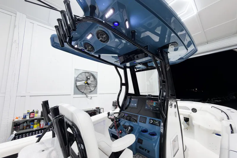 Slide: The Image of 2026 Tidewater 272 CC Adventure boat interior with advanced navigation and control systems. - 16