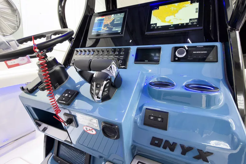 Slide: The Image of 2026 Tidewater 272 CC Adventure boat dashboard with advanced navigation and control systems. - 21