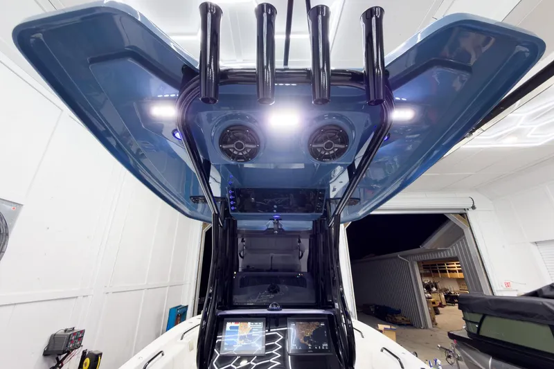 Slide: The Image of 2026 Tidewater 272 CC Adventure boat interior with advanced navigation and lighting systems. - 35