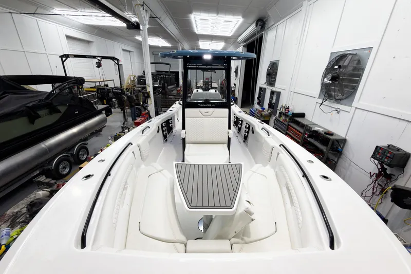 Slide: The Image of 2026 Tidewater 272 CC Adventure boat interior in a workshop setting. - 42