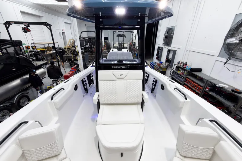 Slide: The Image of 2026 Tidewater 272 CC Adventure boat interior in a workshop setting. - 47