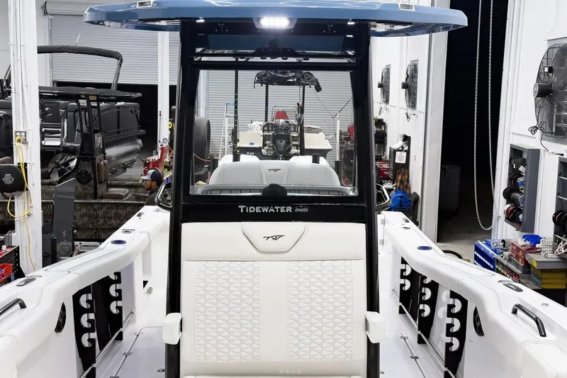 Slide: The Image of 2026 Tidewater 272 CC Adventure boat interior in a workshop setting. - 48