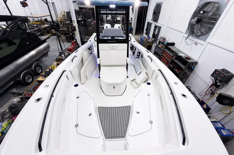 Slide: The Image of 2026 Tidewater 272 CC Adventure boat interior in a workshop setting. - 54